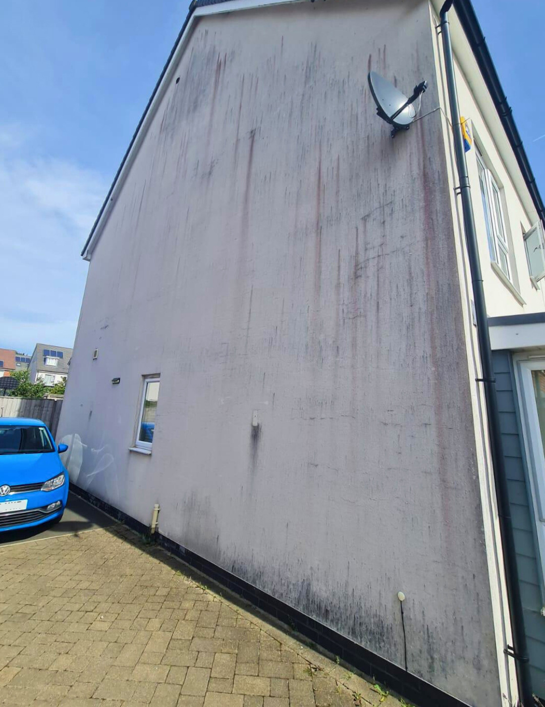 Weathered facade in Leicester before algae-resistant silicone finish.