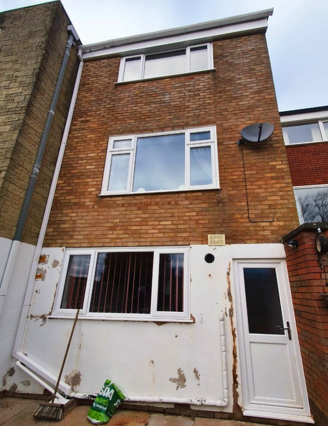 Aged exterior walls in Solihull before luxury silicone rendering installation