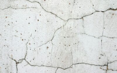 Render Looking Tired? What Causes Cracks, Stains & Green Growth